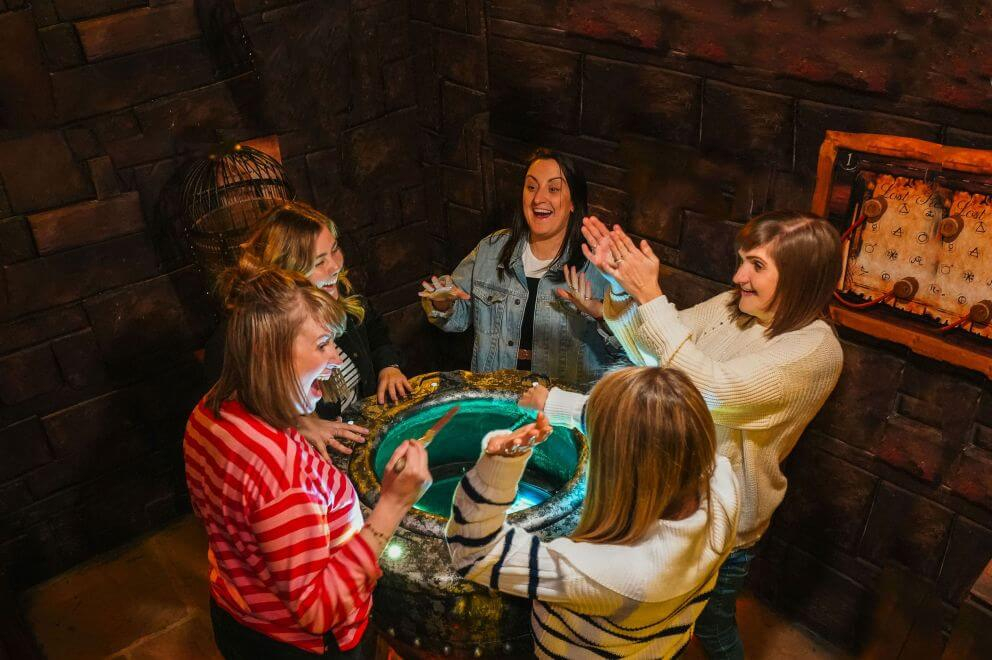 A group of people standing around a puzzle